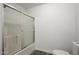 Bathroom with shower/tub combo, toilet, and wood-look flooring at 1430 W Maddock Rd, Phoenix, AZ 85086