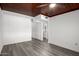 Bedroom with wood-look floors, wood ceiling, and ensuite bathroom access at 1430 W Maddock Rd, Phoenix, AZ 85086