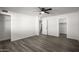 Bedroom with ceiling fan, wood-look flooring, and open door to hallway at 1430 W Maddock Rd, Phoenix, AZ 85086