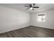 Bedroom with ceiling fan and wood-look flooring at 1430 W Maddock Rd, Phoenix, AZ 85086