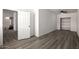 Empty bedroom with ceiling fan, closet, and wood-look flooring at 1430 W Maddock Rd, Phoenix, AZ 85086