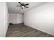 Empty bedroom with ceiling fan, closet, and wood-look flooring at 1430 W Maddock Rd, Phoenix, AZ 85086