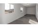Bonus room with windows, gray carpet, and white walls at 1430 W Maddock Rd, Phoenix, AZ 85086