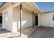 Exterior view of the house with a covered entryway and white walls at 1430 W Maddock Rd, Phoenix, AZ 85086