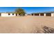 Exterior view of a home with a detached garage and desert landscape at 1430 W Maddock Rd, Phoenix, AZ 85086