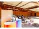 Garage with wooden walls, storage shelves, and various stored items at 1430 W Maddock Rd, Phoenix, AZ 85086
