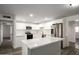 Modern white kitchen with quartz countertops, subway tile backsplash, and stainless steel appliances at 1430 W Maddock Rd, Phoenix, AZ 85086