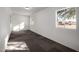 Bright sunroom or enclosed patio with tiled flooring, windows, and white walls at 1430 W Maddock Rd, Phoenix, AZ 85086