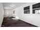 Sunroom or enclosed patio with tiled flooring, multiple windows, and white walls at 1430 W Maddock Rd, Phoenix, AZ 85086