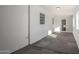 Sunroom or enclosed patio with tiled flooring, multiple windows, and white walls at 1430 W Maddock Rd, Phoenix, AZ 85086
