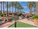 Community plaza with water feature, benches, and lush landscaping at 15720 W Goldenrod Dr, Surprise, AZ 85374