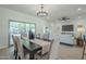 Dining area with access to backyard through sliding glass doors at 15720 W Goldenrod Dr, Surprise, AZ 85374