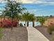 Walkway leading to a gated community pool area at 18169 W Cactus Flower W Dr, Goodyear, AZ 85338