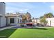 Relaxing backyard oasis featuring a pool and lounge chairs at 2264 E Holmes Ave, Mesa, AZ 85204