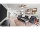 Open living room featuring a comfortable sectional sofa and a view into the kitchen at 2264 E Holmes Ave, Mesa, AZ 85204