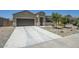 Inviting single-story home with a two-car garage and landscaped front yard at 30098 N Cholla Dr, Florence, AZ 85132