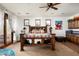 Relaxing bedroom with a rustic wooden bed and access to a balcony at 35150 N 53Rd Pl, Cave Creek, AZ 85331