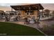 Cozy firepit seating area with brick accents and comfortable chairs at 35300 N Barley St, San Tan Valley, AZ 85144