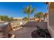 Relaxing front patio with seating area and desert plants at 3721 N 150Th Ct, Goodyear, AZ 85395