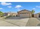 Front yard of a single-story home with a two-car garage, desert landscaping, and a partially fenced perimeter at 3763 S Loback Ln, Gilbert, AZ 85297