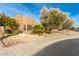 Front yard landscaping with desert plants, rocks, and a paved walkway at 4314 W Saguaro Park Ln, Glendale, AZ 85310