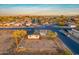 Aerial view of the property on a corner lot, neighboring houses, and the surrounding area at 4426 S 21St St, Phoenix, AZ 85040