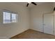 Inviting bedroom with large window and carpeted flooring at 4426 S 21St St, Phoenix, AZ 85040