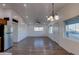 Bright and open living room with wood-style flooring and ceiling fan at 4426 S 21St St, Phoenix, AZ 85040