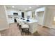 Bright, updated kitchen featuring white shaker cabinets, stainless steel appliances, and an oversized island at 4636 E Florian Ave, Mesa, AZ 85206