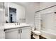 Clean and bright bathroom with a white vanity, toilet, and bathtub at 4711 N 212Th Dr, Buckeye, AZ 85396
