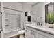 Clean, modern bathroom with white vanity and tiled floor at 4711 N 212Th Dr, Buckeye, AZ 85396