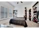 Bedroom with ample storage, natural light, and a comfortable bed at 4711 N 212Th Dr, Buckeye, AZ 85396