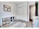 Bright bedroom featuring sliding closet doors and neutral decor at 4711 N 212Th Dr, Buckeye, AZ 85396