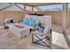 Outdoor patio with a fire pit and comfortable seating at 4711 N 212Th Dr, Buckeye, AZ 85396