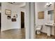 Powder room with a pedestal sink and decorative wall art at 4711 N 212Th Dr, Buckeye, AZ 85396