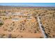 Aerial shot of two new homes in a desert setting with mountain views at 51937 W Wildwood Rd, Maricopa, AZ 85139