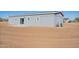 Backyard view of the single-story home with open space and desert landscape at 51937 W Wildwood Rd, Maricopa, AZ 85139