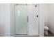 Walk-in shower with glass door and modern fixtures in the bathroom at 51937 W Wildwood Rd, Maricopa, AZ 85139