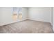 Spacious bedroom with plush carpeting and large windows at 51937 W Wildwood Rd, Maricopa, AZ 85139