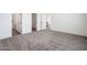 Large main bedroom with carpeting, an ensuite bathroom, and closet access at 51937 W Wildwood Rd, Maricopa, AZ 85139