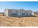 Front exterior view of a single-story home with a simple design at 51937 W Wildwood Rd, Maricopa, AZ 85139