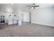 Open-concept living room and kitchen area with modern finishes at 51937 W Wildwood Rd, Maricopa, AZ 85139