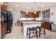 Kitchen boasts an island with seating and ample cabinet space at 5907 W Running Deer Trl, Phoenix, AZ 85083