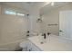 Clean and modern bathroom with a shower-tub combo and single vanity at 6638 W Hughes Dr, Phoenix, AZ 85043