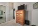 Bedroom featuring carpeted floors, dresser, and wall-mounted TV at 692 E Dry Creek Rd, San Tan Valley, AZ 85143