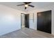 Spacious bedroom with closet and built-in shelving and wood-look floors at 7823 N 60Th Ave, Glendale, AZ 85301