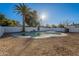 Backyard pool with gravel landscaping and a palm tree at 7823 N 60Th Ave, Glendale, AZ 85301