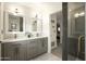 Elegant bathroom with double vanity and a separate shower at 9919 N 47Th Pl, Phoenix, AZ 85028