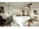 Bright bedroom with plush bed and ensuite access at 9919 N 47Th Pl, Phoenix, AZ 85028