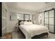 Spacious bedroom with comfy bed and access to bathroom at 9919 N 47Th Pl, Phoenix, AZ 85028